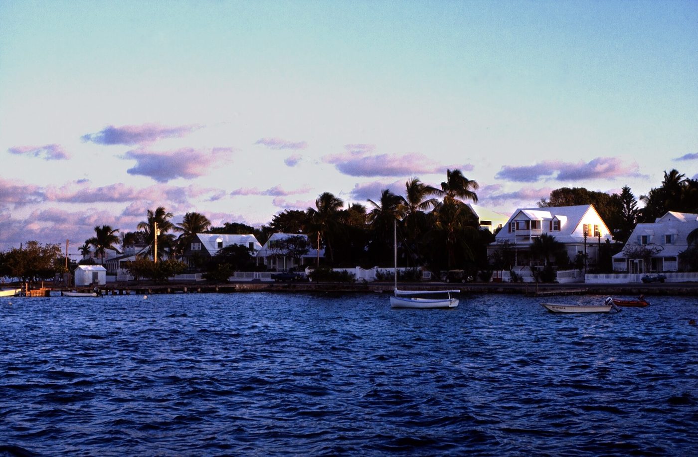 Dunmore Town seen from Governor's Dock across calm water