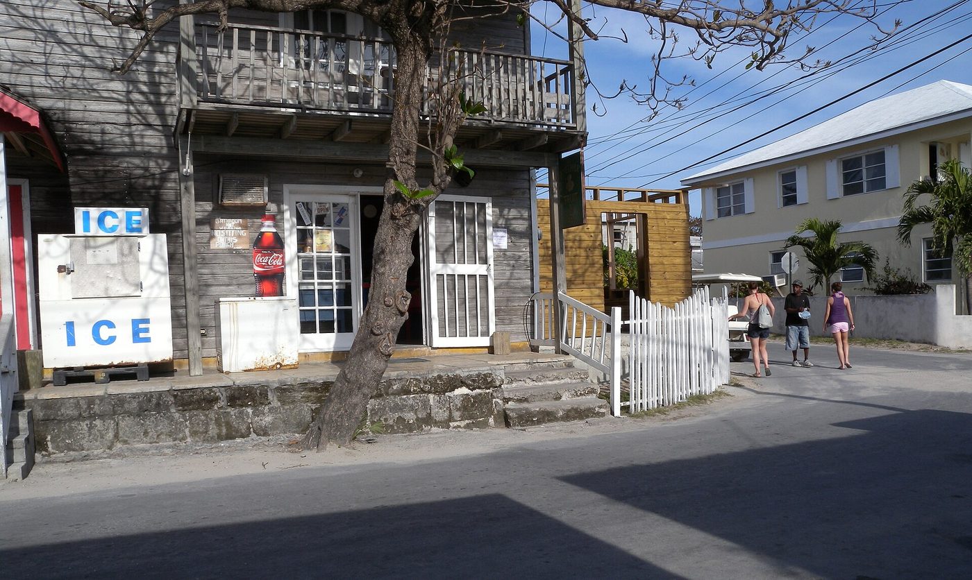 A wooden fruit and vegetable shop with an ICE sign, Harbour Island